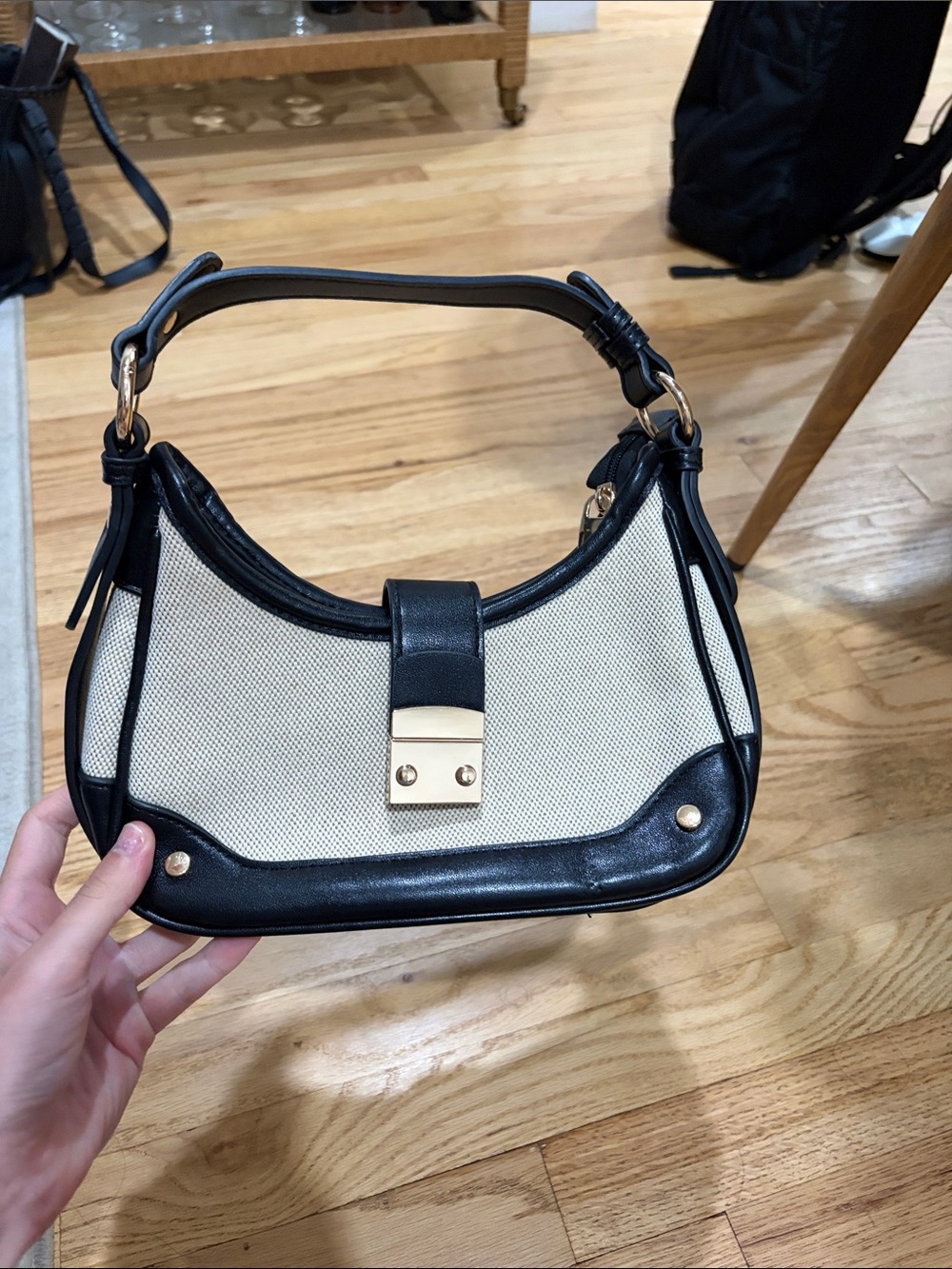Structured Cream and Black Shoulder Bag with Gold Hardware